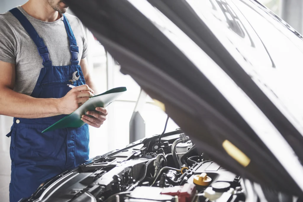 portrait-mechanic-work-his-garage