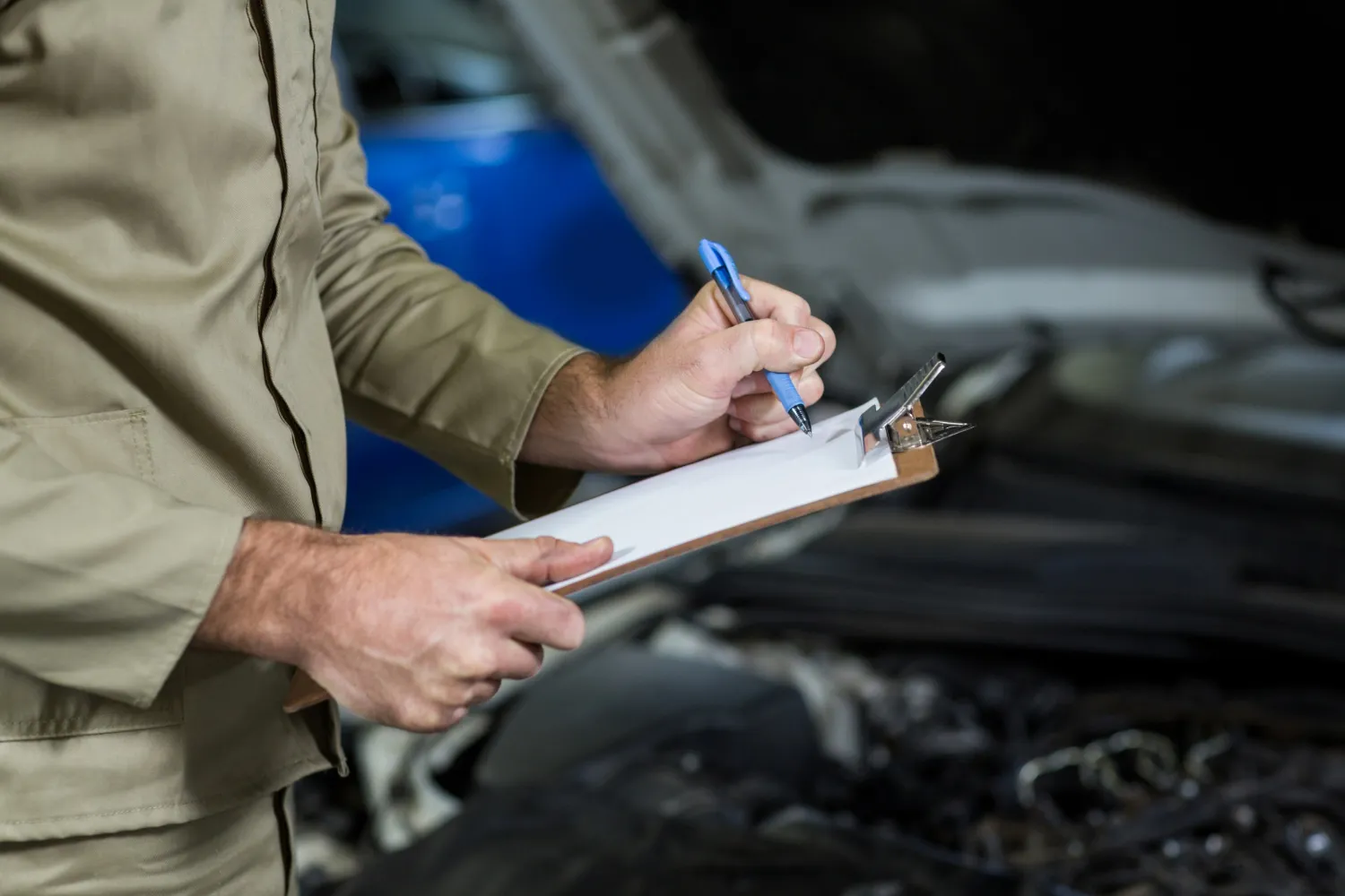 mechanic checking the service schedule