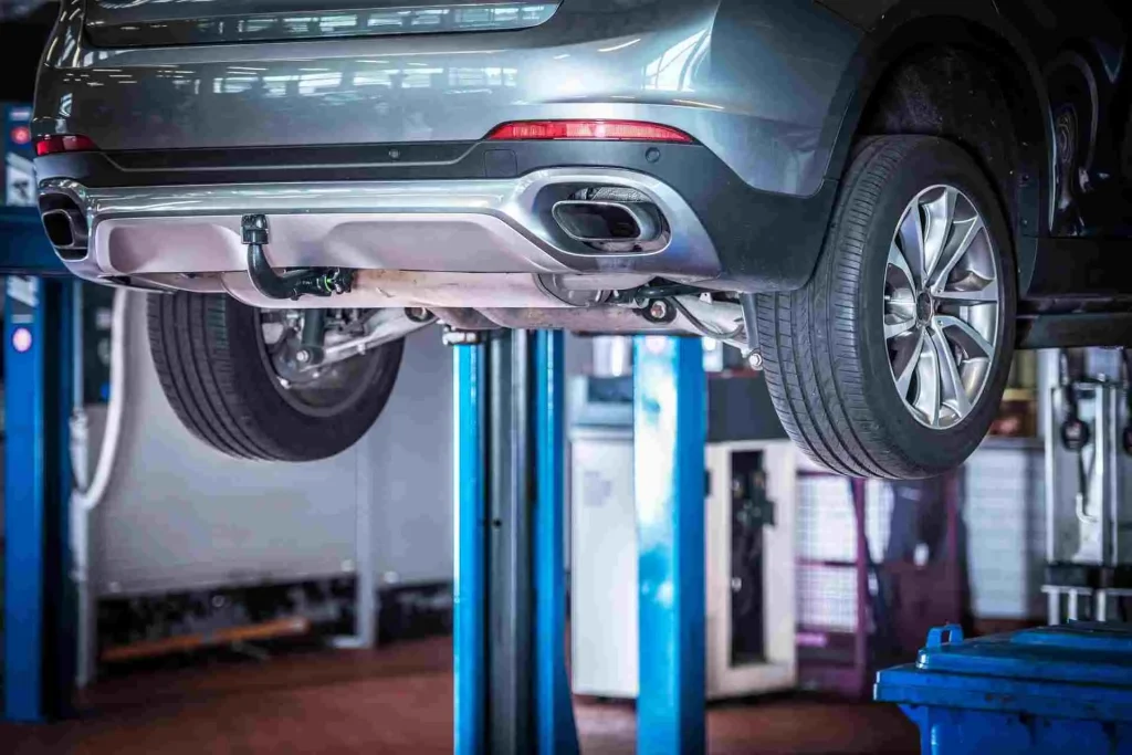 broken car repair on a lift