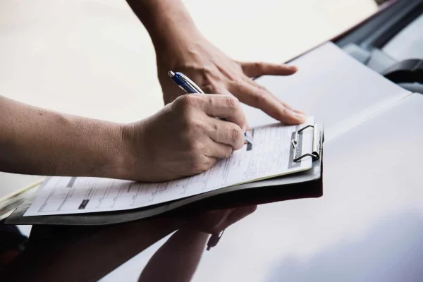 man-working-with-car maintenance checklist people with car