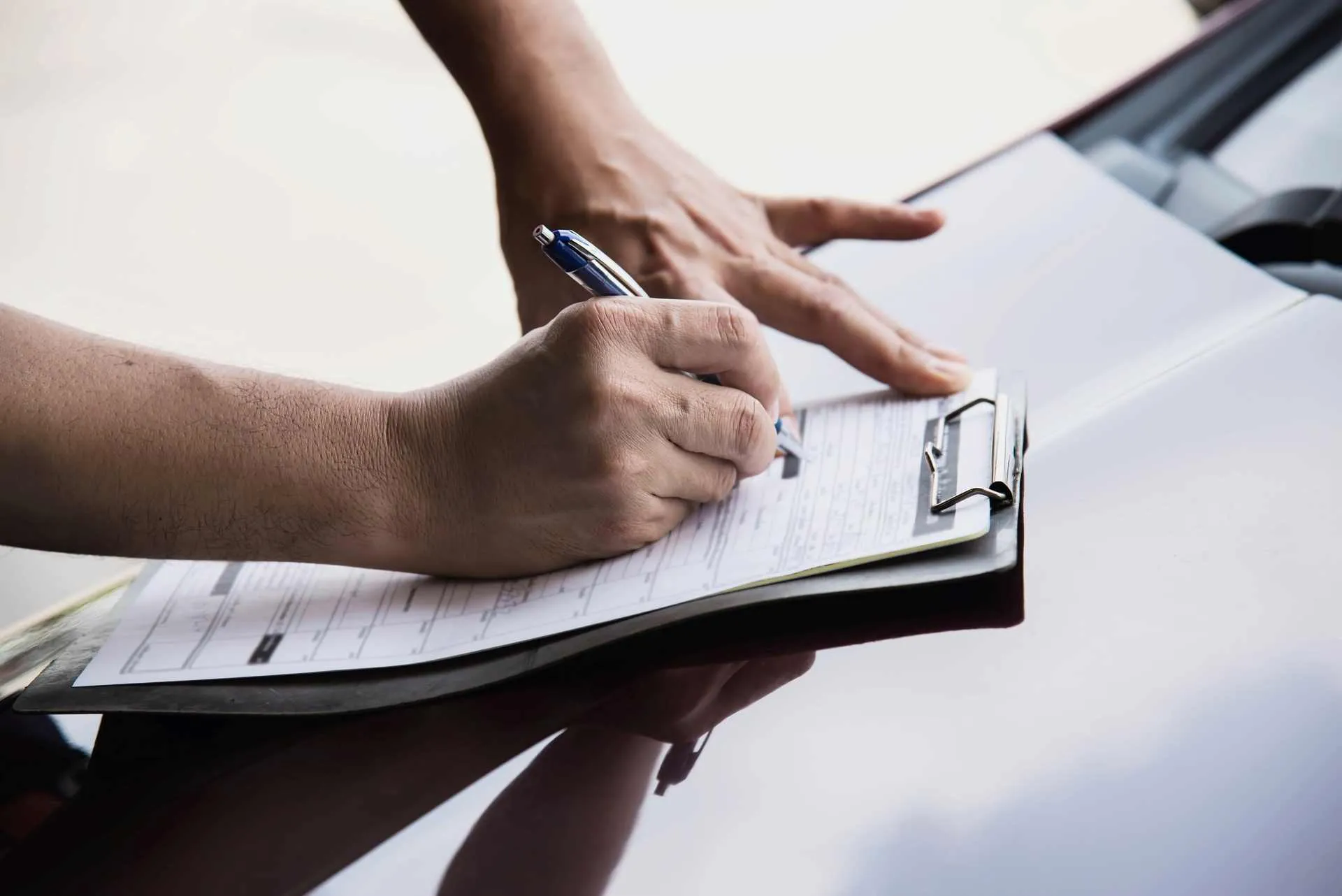 man-working-with-car maintenance checklist people with car