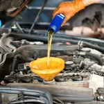 Topping Up The Cars Oil